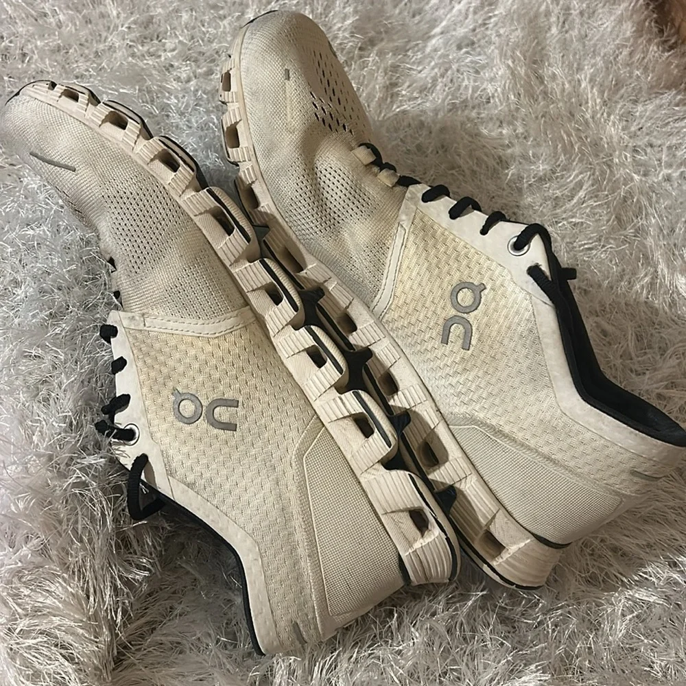 On Running Black and Cream Athletic Shoes